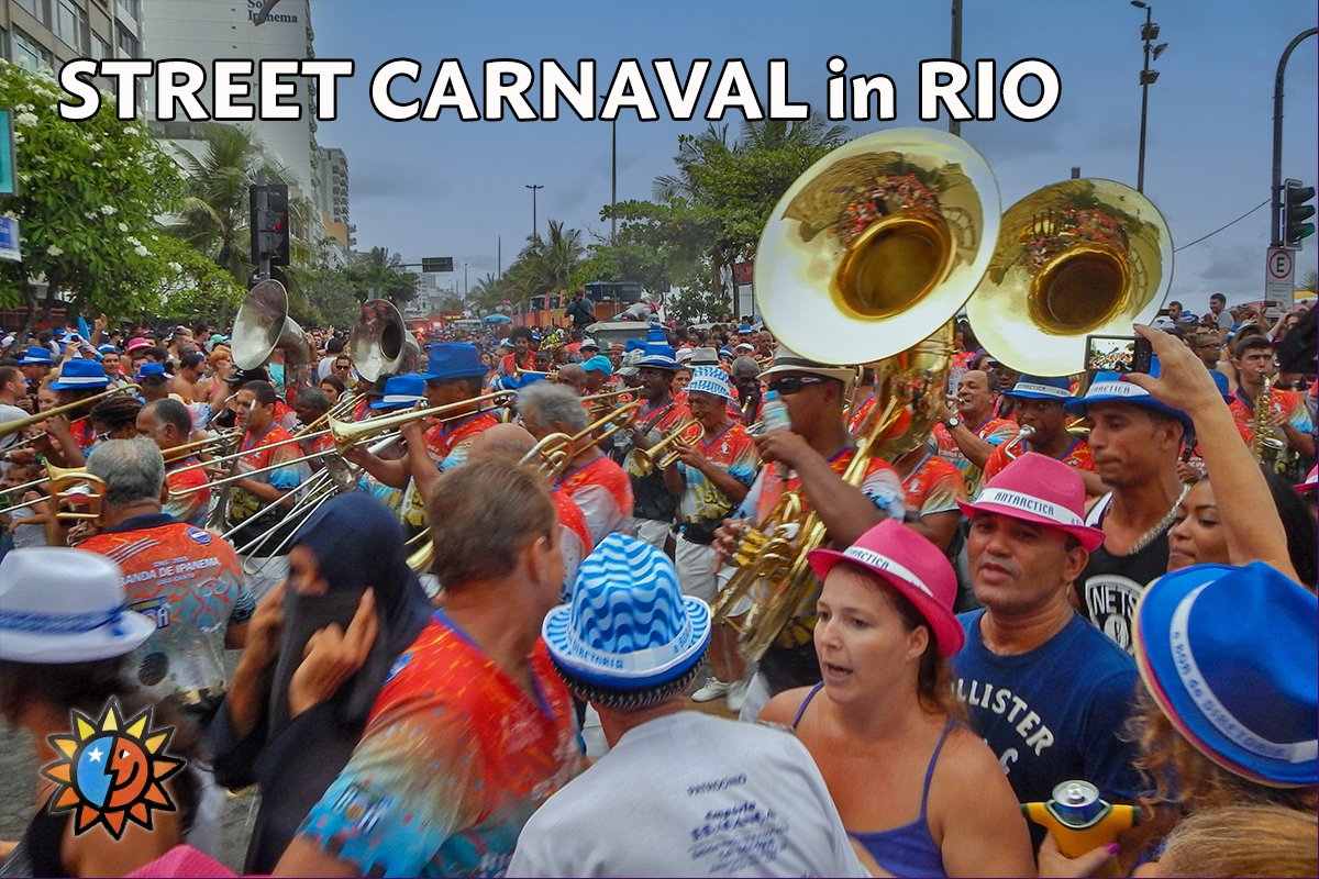 Percussion band marching along Ipanema Beach playing favorite Carnaval songs to thousand of revelers.