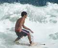 Surfing in Ipanema. Photo by Silviano courtesy of www.ipanema.com.